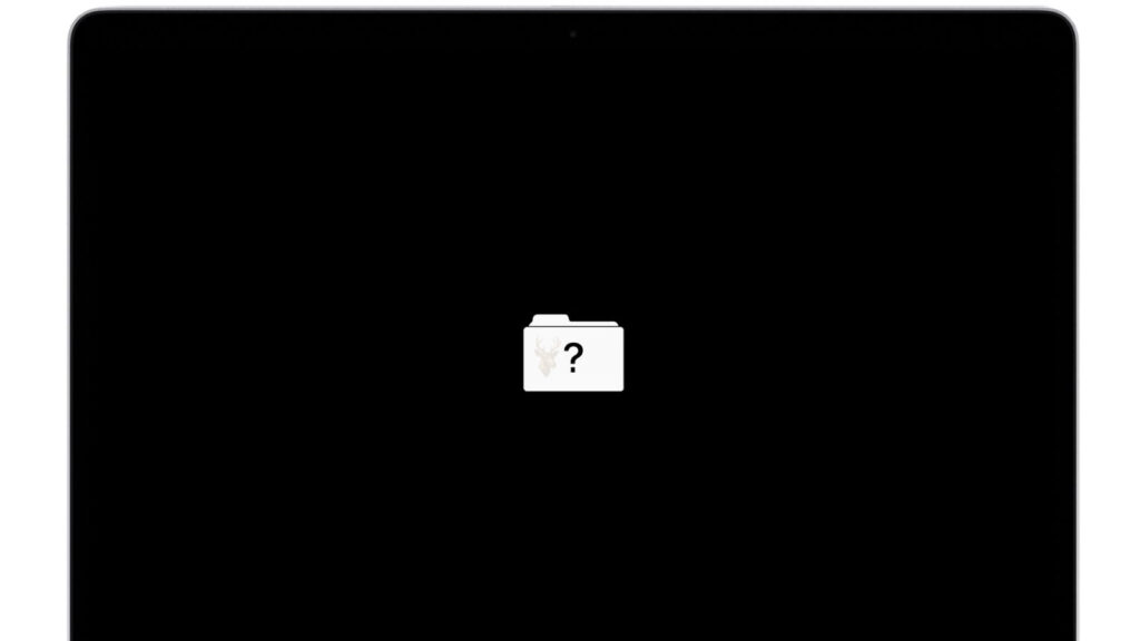 MacBook Pro displaying a flashing folder with a question mark, indicating that the startup disk cannot be found.
