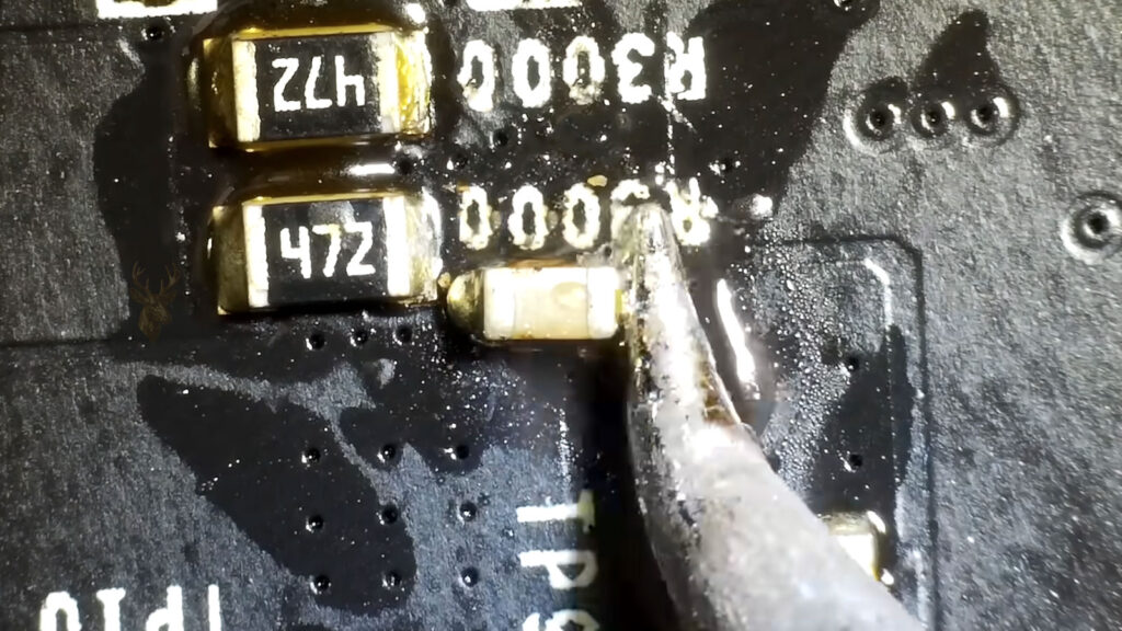 Graphics card capacitor replacement being performed during desktop PC display repair diagnostics