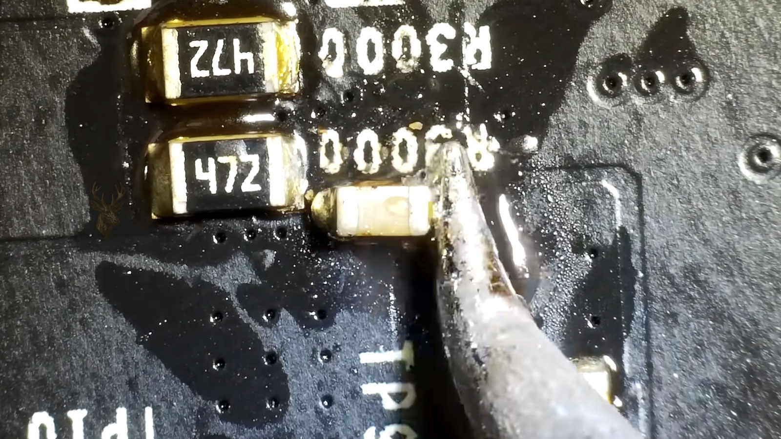 Graphics card capacitor replacement being performed during desktop PC display repair diagnostics