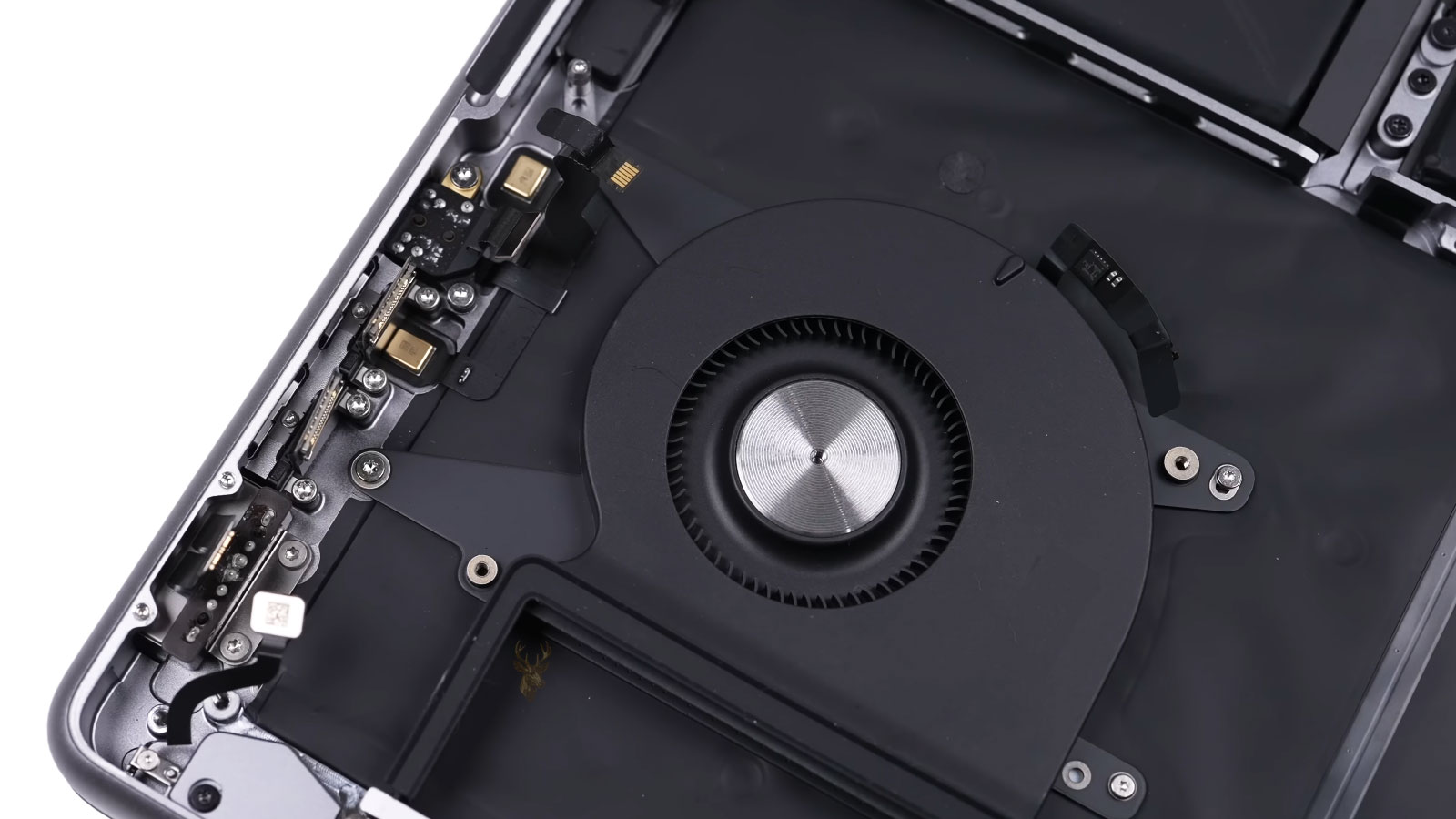 Opened Mac computer with internal components removed near cooling fan