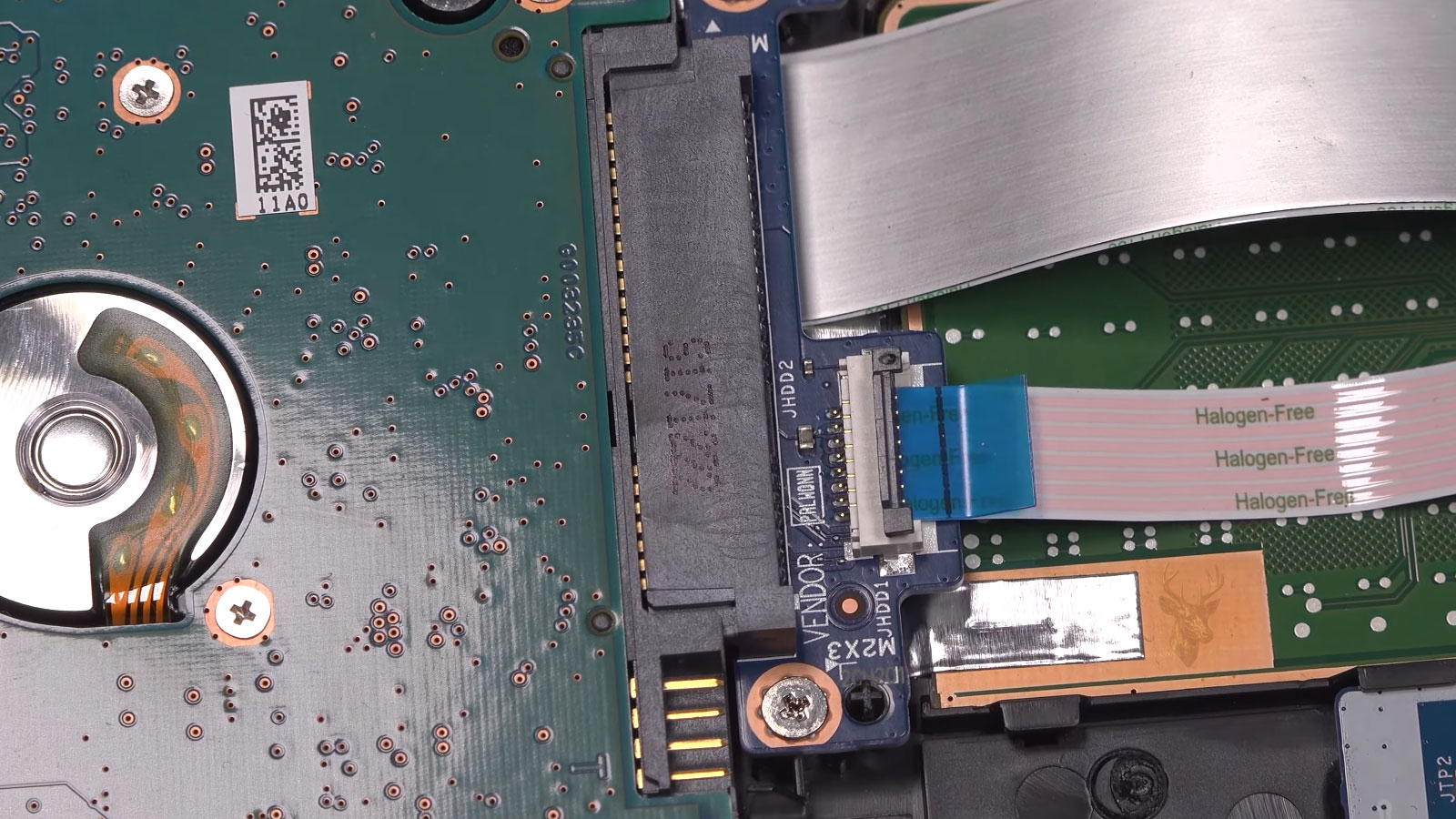 Laptop opened with 2.5 inch hard drive being removed for SSD replacement