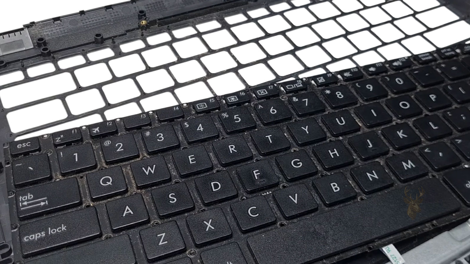 Laptop keyboard removed from the palm rest during keyboard replacement preparation