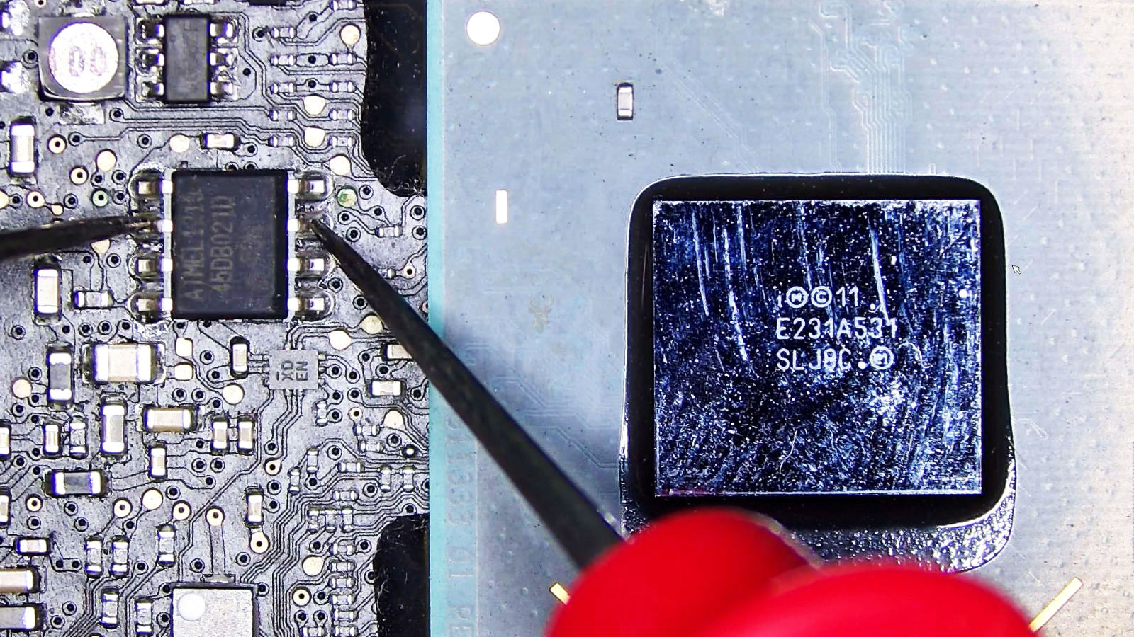 Eight-pin chip being tested for shorts on a computer circuit board.