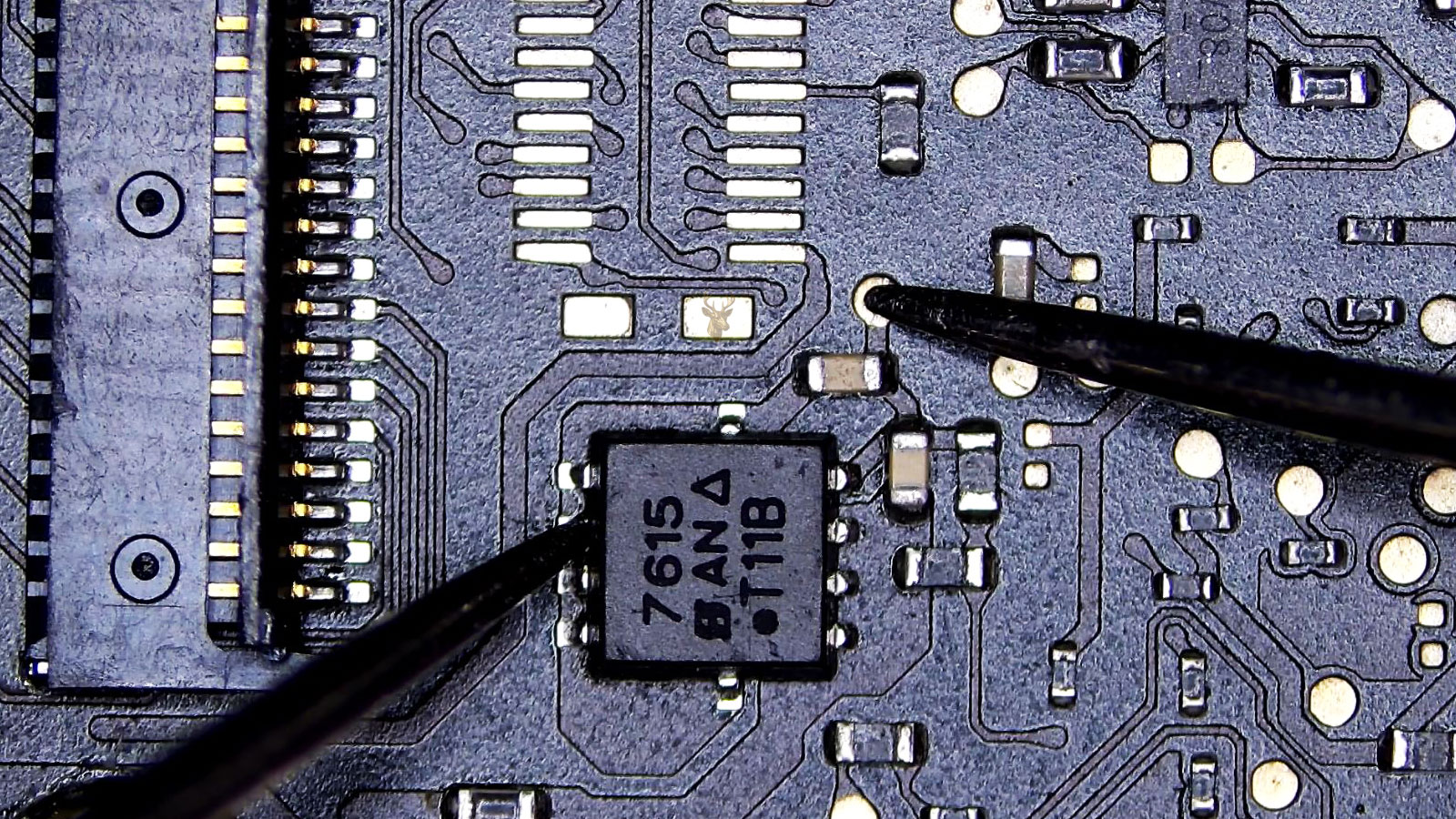7615 power IC being measured from one side pin to a center test pad on the circuit board.
