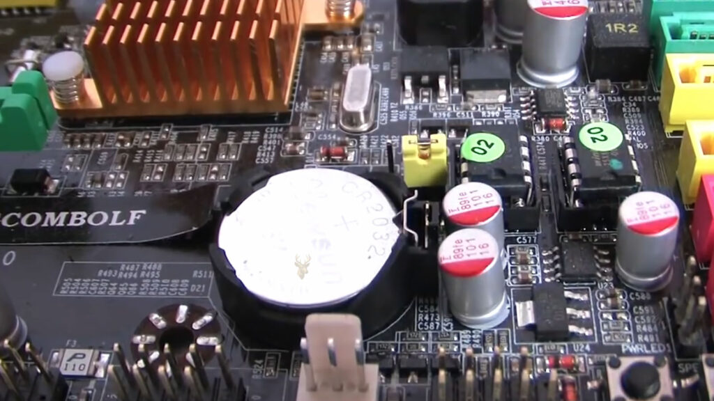 CMOS BIOS battery installed on a computer motherboard.