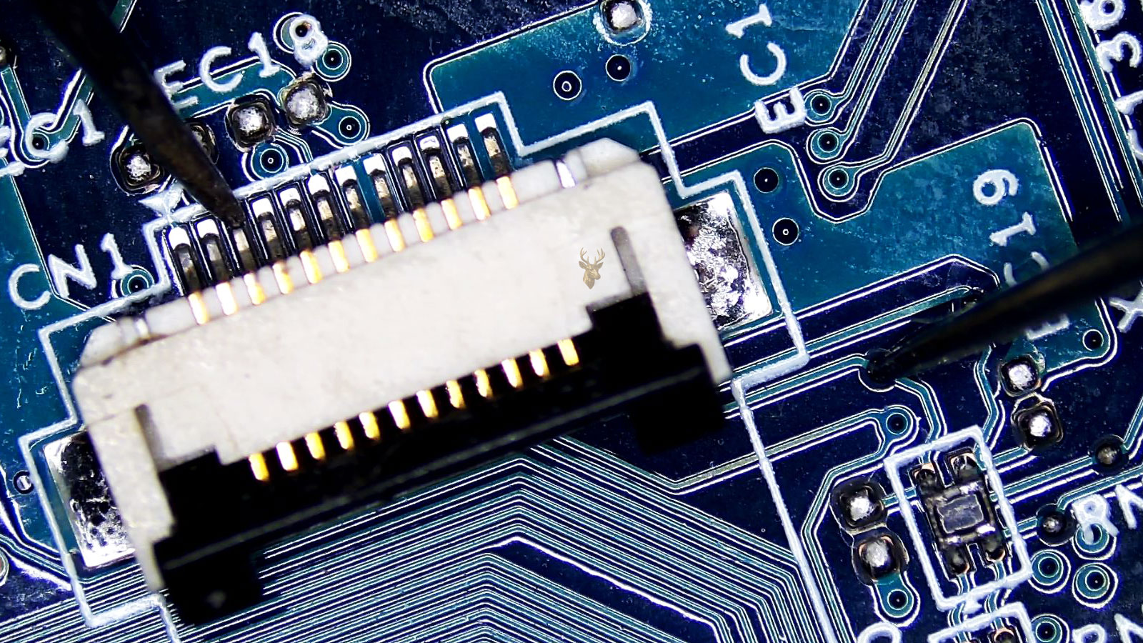 CN1 connector pin being measured to a testing pad on the circuit board.