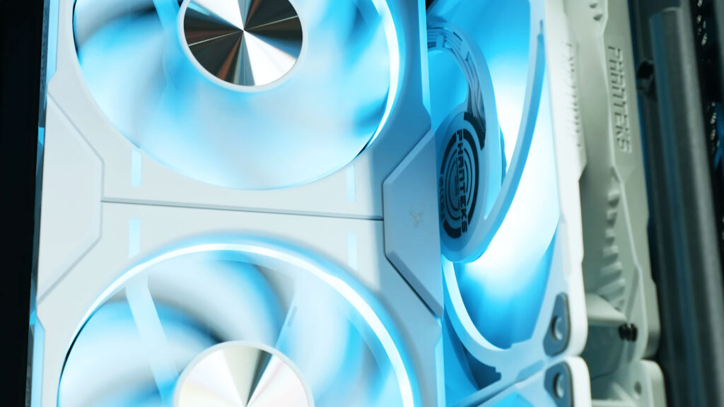 Computer case with multiple blue fans positioned to show intake and exhaust airflow directions.