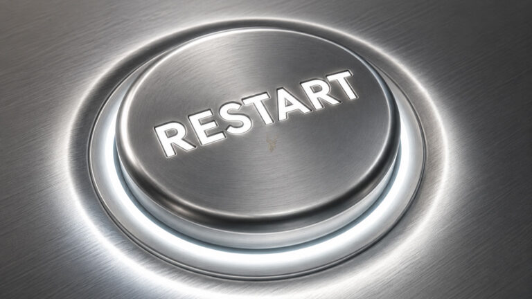Metallic illuminated power button labeled Restart, representing a computer that reboots when a USB device is connected.