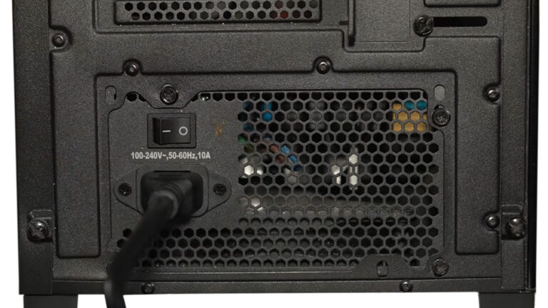 Rear of a desktop computer showing the power supply cable and on-off switch during troubleshooting of an intermittent startup problem.