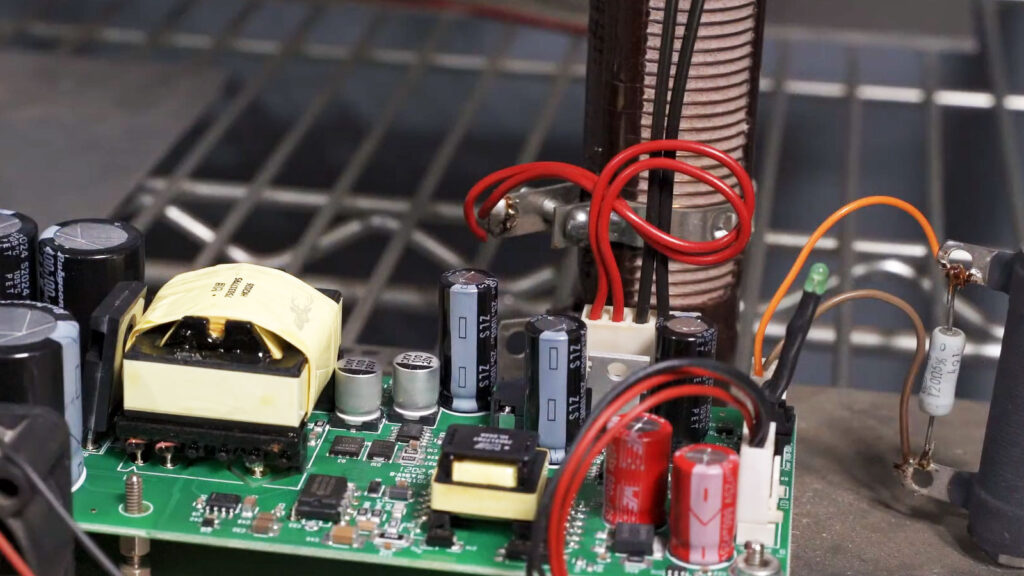 Custom-built hardware burn-in testing device used to verify computer repairs by stressing components under extended operating conditions.