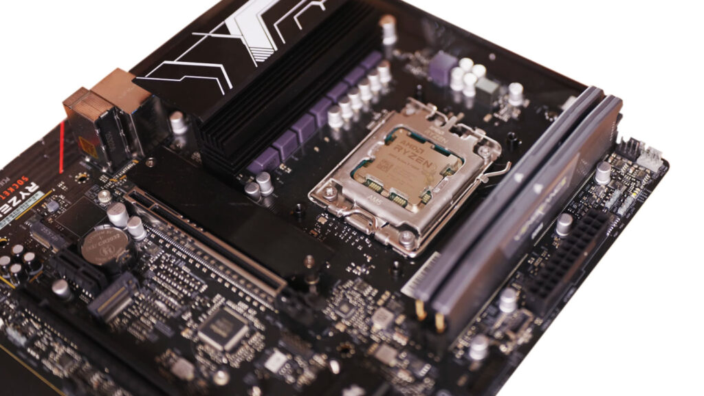 Desktop motherboard with an AMD Ryzen processor and two installed memory modules, representing a computer that detects less RAM than is physically installed.