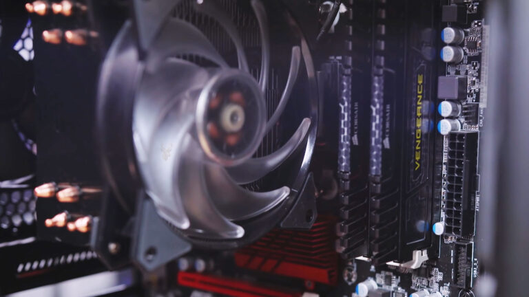 Desktop computer with the CPU cooling fan stopped and the 24-pin motherboard power connector unplugged during power supply troubleshooting.