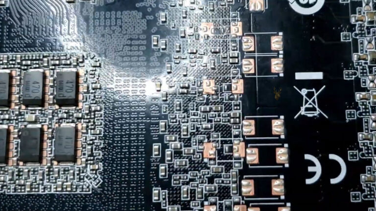 Rear side of a graphics card with capacitors linked to intermittent artifacting and visual corruption during PC gaming.