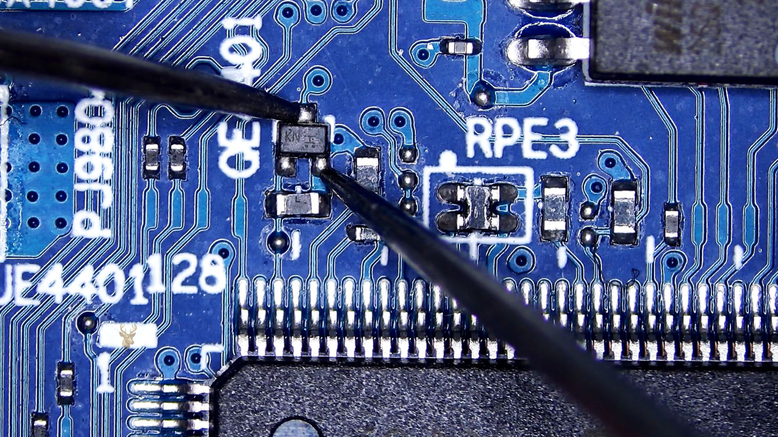 Measuring small transistor KNI located between the Super IO and Winbond BIOS IC chip.