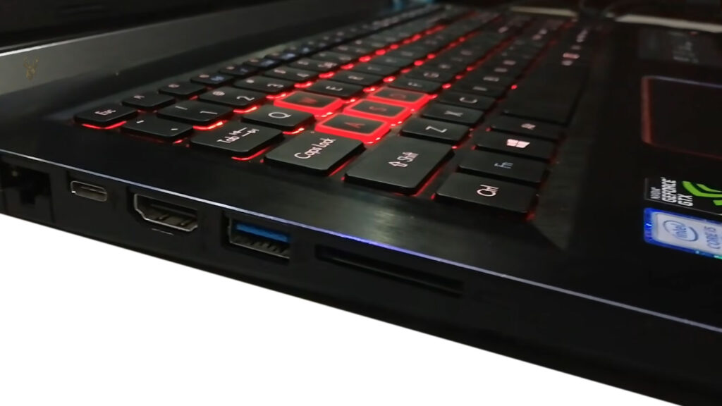 Laptop side view showing USB ports, representing a USB connection that only works when the connector is held at a specific angle.