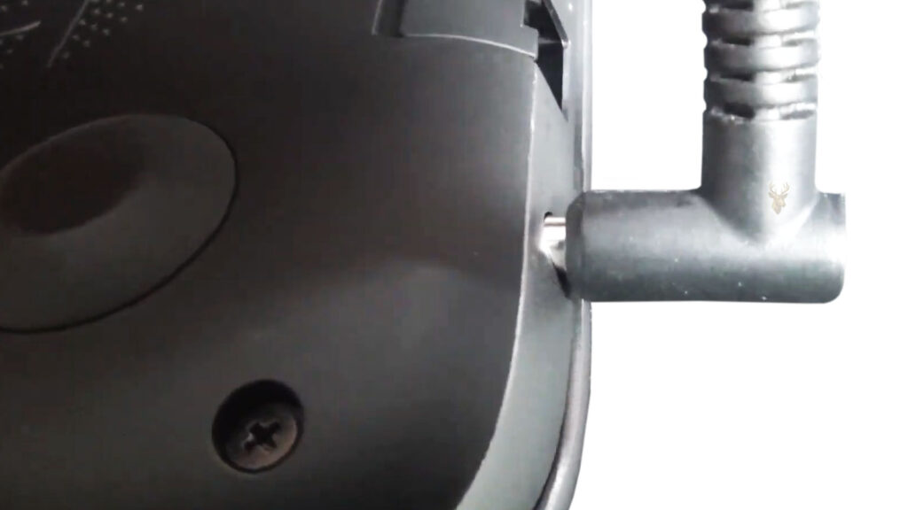 Laptop power adapter connected loosely to the charging port, illustrating an unstable charging connection.