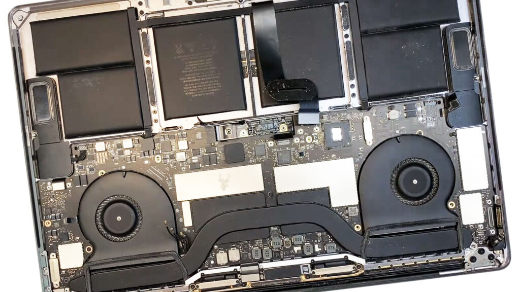 MacBook Pro USB-C ports being inspected for intermittent power delivery issues.