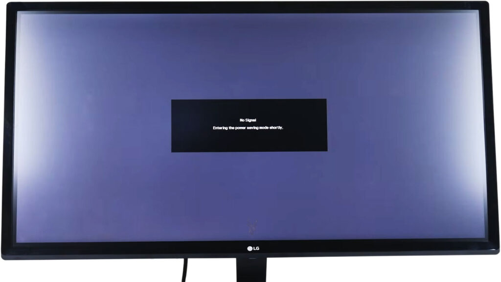 LG monitor displaying a “No Signal” message and entering power-saving mode because no active video input is detected.