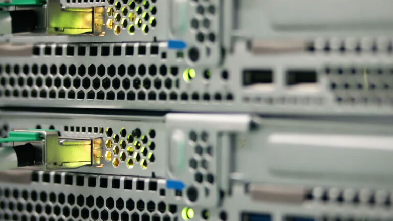 Ethernet switch with green port LEDs indicating active network connections and link status.