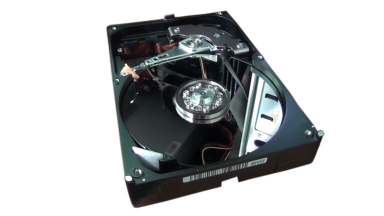 Open hard drive showing the platters and read/write heads before a disk imaging procedure for data recovery.