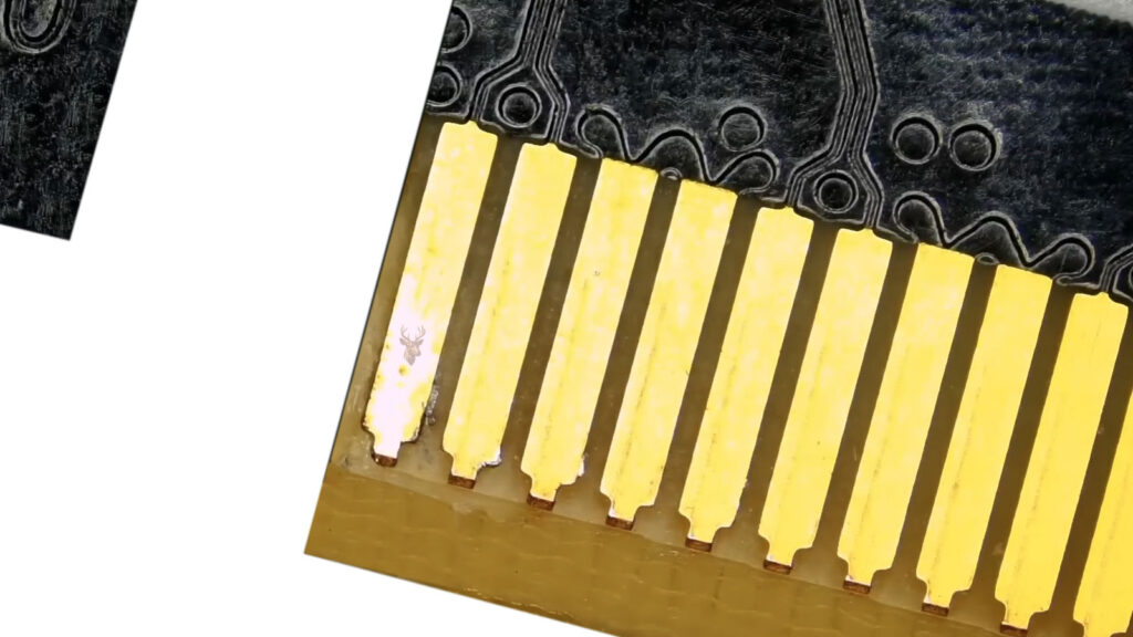 PCIe expansion card edge connector showing oxidized and discolored contact pins that can cause unstable computer connections.