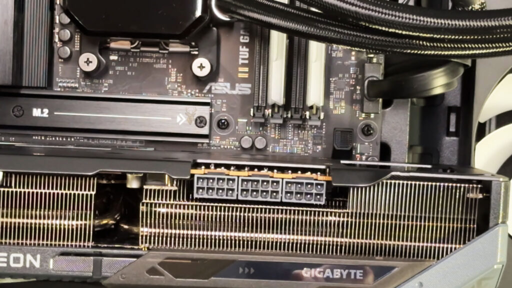 Gaming PC with a Gigabyte graphics card testing PCIe bifurcation across multiple expansion devices.