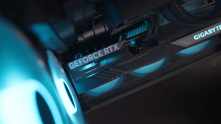 Gigabyte GeForce RTX graphics card mounted vertically with a PCIe riser cable inside a gaming computer.