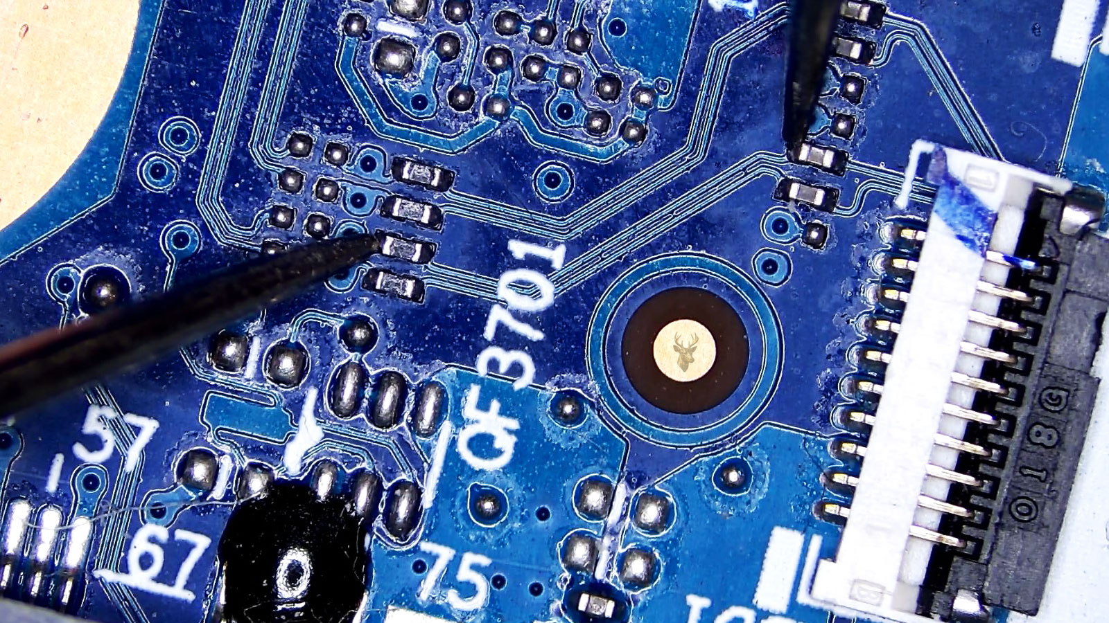 Measurement from a capacitor to a resistor connected by a visible trace in the QF3701 area.