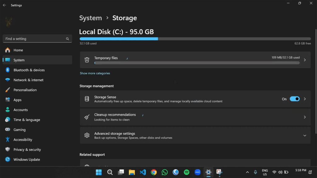 Windows Storage settings showing Storage Sense enabled to automatically reclaim disk space.