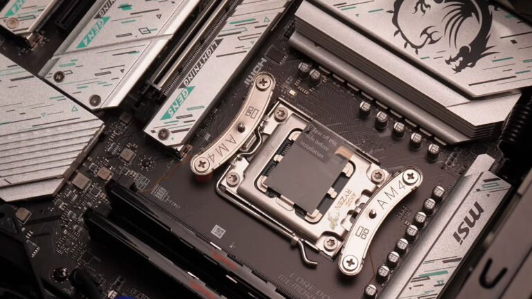 Thermal pad being applied over the CPU area on a computer motherboard.