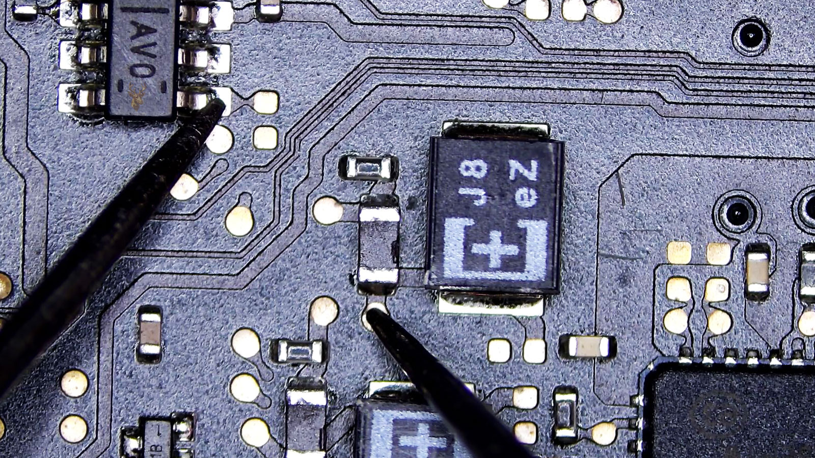 Circuit board section being measured from the AV0 transistor leg to a coil near the J8EZ capacitor.