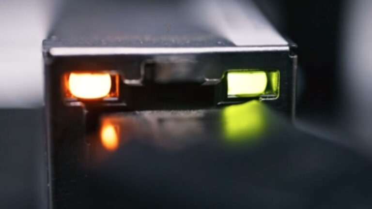 Ethernet LAN port with green and orange LEDs illuminated for Wake-on-LAN functionality.
