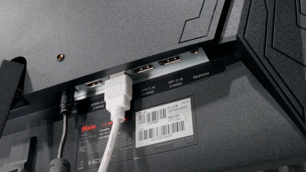 External monitor connected to a computer with an HDMI cable, illustrating a multi-monitor setup in Windows.