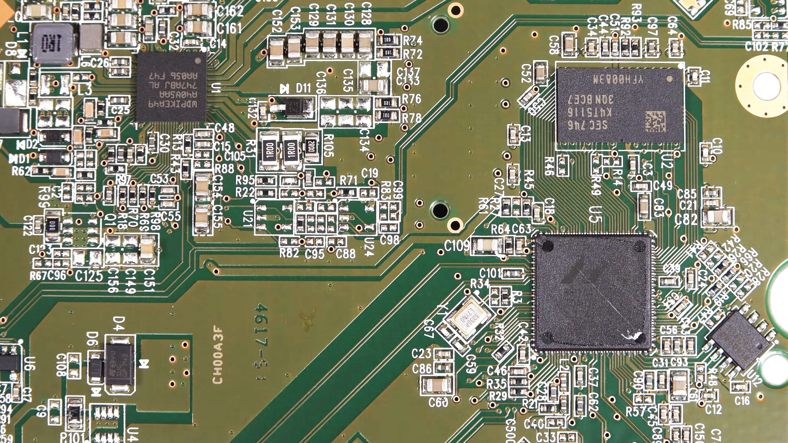 Hard drive circuit board being inspected during the data recovery process.