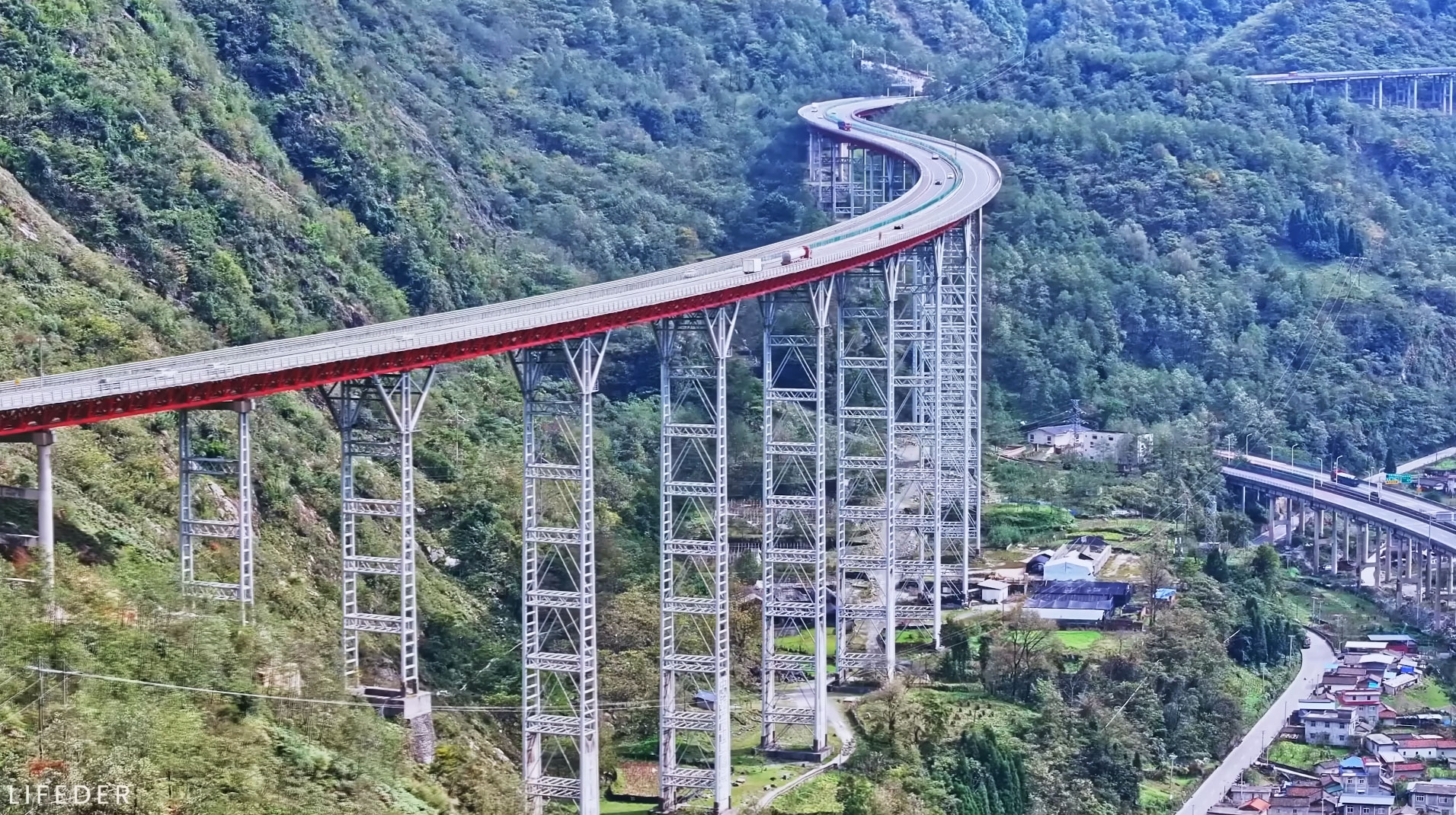Large modern curved bridge showcasing advanced engineering and architectural design.
