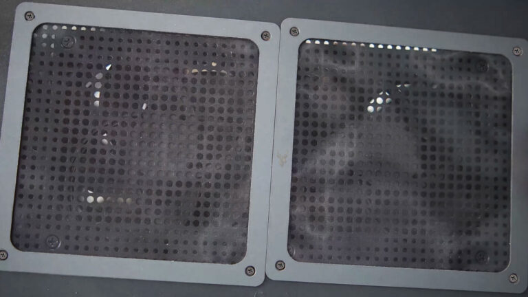 Desktop computer with dust filters installed over two cooling fans to help reduce dust buildup while maintaining airflow.