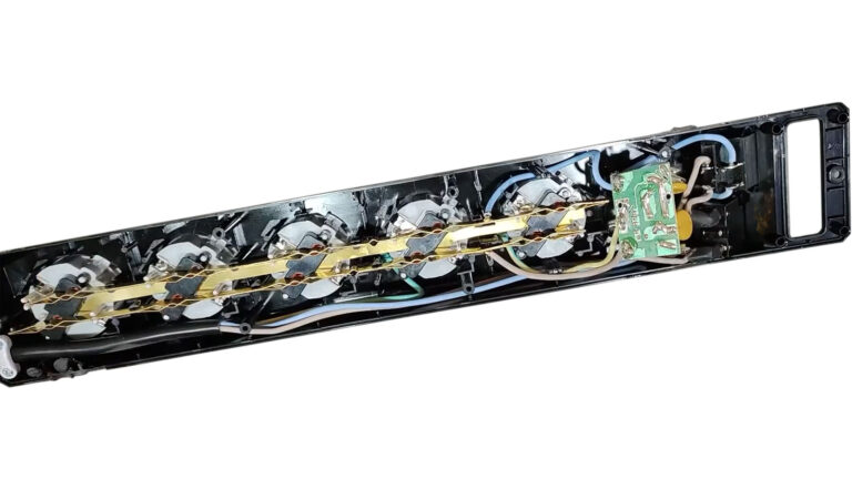 Open surge protector exposing its internal protection components used to help safeguard computers from electrical surges.