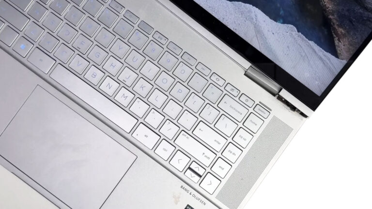 HP x360 laptop with the right hinge pulling the display housing apart and separating the LCD back cover from the rest of the lid.