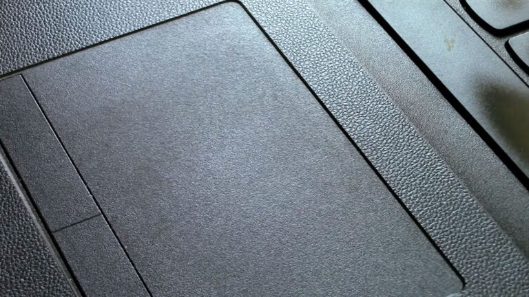 Laptop touchpad being used while the cursor does not respond to finger movement.