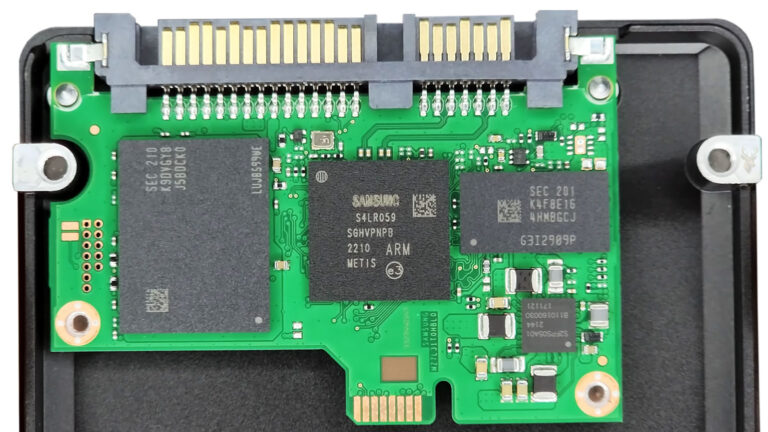 Open Samsung solid-state drive exposing the controller, NAND flash memory chips, and internal circuit board.