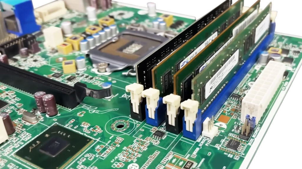 Motherboard populated with four ECC memory modules used for improved data reliability and error correction.