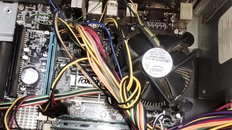Foxconn motherboard after an unexpected restart, with the cooling fan stopped momentarily before the system powers on again.